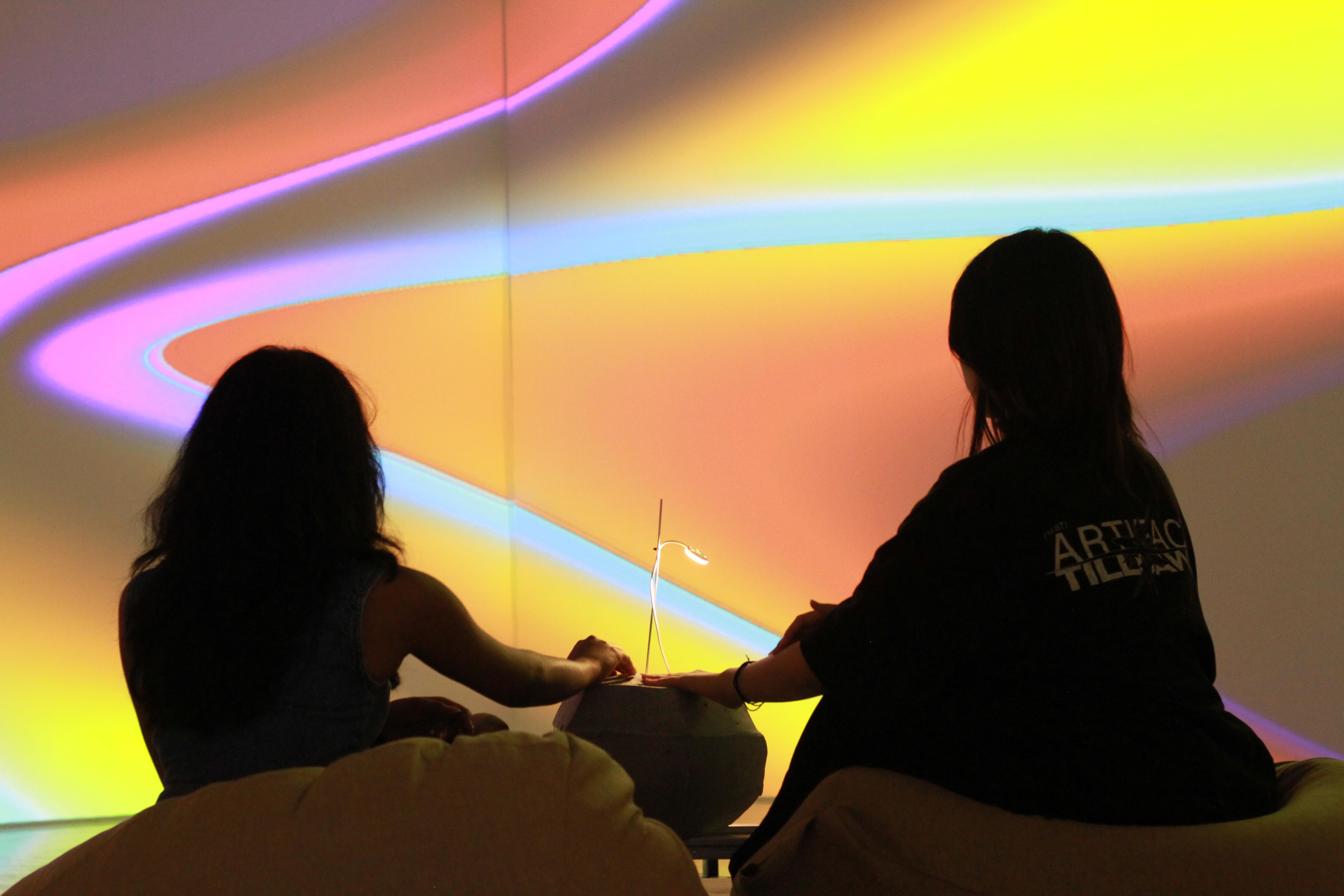 Visitors interacting with projection-based installation